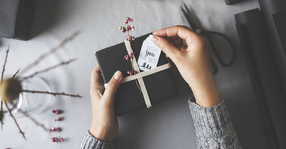 A woman wrapping a gift